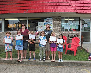 SPECIAL TO THE VINDICATOR
Girl Scout Troop 80777 of Columbiana bridging ceremony took place Aug. 7 at Columbiana Dairy Queen, where the girls toured the restaurant and decorated ice cream cupcakes. The group, which meets on a biweekly basis, moved from the Daisy level to the Brownie level. In front are Abbie Passmore, Katrina Kaszowski, Alaina Johnston, Elizabeth Siembida, Rebekah Clark and Chloe Gill. In back are leaders Kathy Kaszowski and Crystal Siembida Boggs. Not pictured are Mia Surgenivic and Airianna Scullion. For information on membership call Boggs at 330-482-9105.