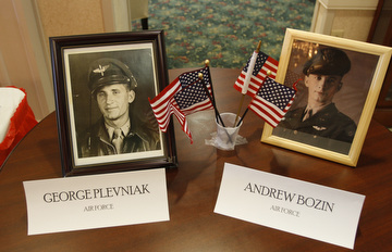 A photo with the names and flags of World War II veterans at Windsor House at Liberty Arms was displayed at Crossroads Hospice's service honoring vets.
