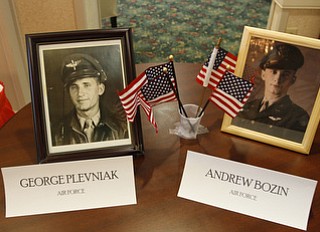 A photo with the names and flags of World War II veterans at Windsor House at Liberty Arms was displayed at Crossroads Hospice's service honoring vets.