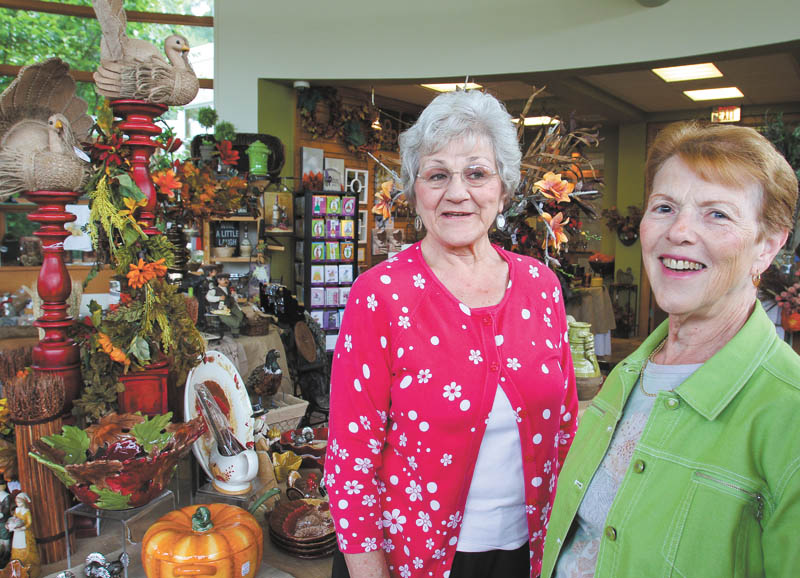 Beverly Italiano, left, and Carolyn Little are members of the Lizzies, a group of employees, volunteers and benefactors of Fellows Riverside Gardens that supports Fellows as a social organization. WILLIAM D. LEWIS | THE VINDICATOR
