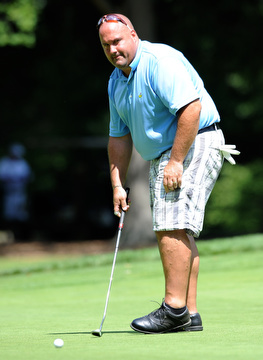 Golfer Jay Monigold of Salem reacts after pushing a putt wide of the cup on the 9th hole on the north course Friday afternoon at Mill Creek Golf Corse part of the Vindy Greatest Golfer on August 23, 2013.