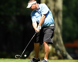 Golfer Brian Myers of New Middletown tees off on the 10th hole on the south corse course Friday afternoon at Mill Creek Golf Corse part of the Vindy Greatest Golfer on August 23, 2013.