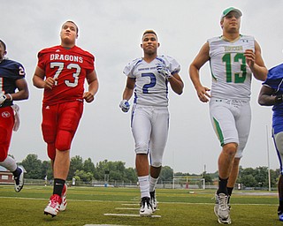 MADELYN P. HASTINGS | THE VINDICATOR..(L-R) Darrin Hall from Fitch, Josh Krok from Niles, Darien Townsend from Youngstown Christian, Chris Durkin from Ursuline, and L.J. Scott from Hubbard, pose for a portrait at the Fitch Stadium on Saturday, July 27.... - -30-..