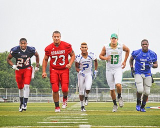 MADELYN P. HASTINGS | THE VINDICATOR..(L-R) Darrin Hall from Fitch, Josh Krok from Niles, Darien Townsend from Youngstown Christian, Chris Durkin from Ursuline, and L.J. Scott from Hubbard, pose for a portrait at the Fitch Stadium on Saturday, July 27.... - -30-..