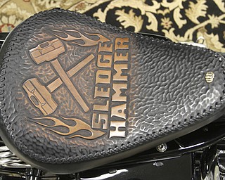 William D. Lewis\The VindicatorWilliam D. Lewis\The Vindicator Custom seat on a Sledgehammer Bobbers motorcycleThe Howland business is building an Evil Knievel tribute motorcycle..
