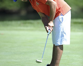 Golfer Frankie Sferra of Springfield follows through on his putt as it makes its way to the hole on the 9th hole Saturday afternoon at Youngstown Country Club as part of the Vindy Greatest Golfer tournament on August 24.
