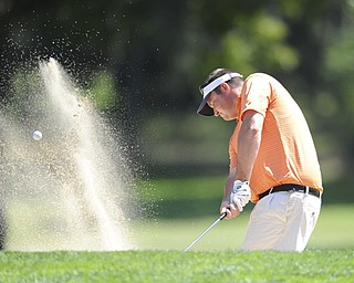 Golfer Steve Smoot of Brookfield chips out of the sand trap and onto the green on the 8th hole Saturday afternoon at Youngstown Country Club as part of the Vindy Greatest Golfer tournament on August 24.