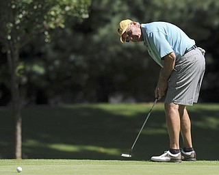 Golfer Ed Antonelli of Howland follows through on his putt on the 10th hole Saturday afternoon at The Lake Club as part of the Vindy Greatest Golfer tournament on August 24.