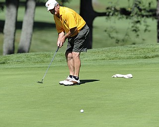 Golfer Albert Pacella of Struthers watches his putt break to the hole on the 17th hole Saturday afternoon at The Lake Club as part of the Vindy Greatest Golfer tournament on August 24.