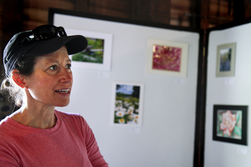 MADELYN P. HASTINGS | THE VINDICATOR..Linda Lambert of Bethesda, MD admires the artwork on display in the LantermanÕs Mill art show which ran Friday-Sunday on the second floor of the mill. Artwork included photographs, paintings, and drawings..... - -30-..