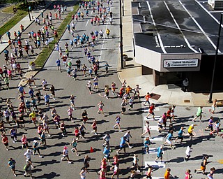 MADELYN P. HASTINGS | THE VINDICATOR..Runners begin their races during the fourth annual Panerathon held at the Covelli Centre on August 25, 2013. The Panerathon is the largest community fundraising event in the Youngstown area that benefits the Joanie Abdu Comprehensive Breast Care Center.... - -30-..