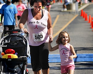 MADELYN P. HASTINGS | THE VINDICATOR..Chrisy Davis  and her daughter Gabriella, 3, of Austintown react after finishing their race together during the Panerathon held at the Covelli Centre on August 25, 2013. The Panerathon is the largest community fundraising event in the Youngstown area that benefits the Joanie Abdu Comprehensive Breast Care Center.... - -30-..