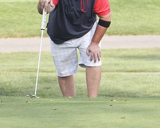 Michael Guerreri lines up his putt on the eighth hole of The Lake Club in Poland during rhe Greatest Golfer of the Valley tournament on Sunday.  Dustin Livesay  |  The Vindicator  8/25/13  Poland.