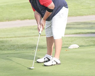 Michael Guerreri smiles as his putt is online of the eighth hole of The Lake Club in Poland during rhe Greatest Golfer of the Valley tournament on Sunday.  Dustin Livesay  |  The Vindicator  8/25/13  Poland.