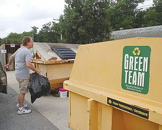 Rich Jones of Poland deposits plastic items at Poland Township’s recycling site, 7474 Clingan Road.