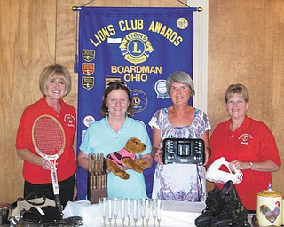 SPECIAL TO THE VINDICATOR
Boardman Lions Club is planning a 20-household garage sale from 9 a.m. to 4 p.m. Sept. 7 at 5226 Pinetree Lane to benefit the community. Parking is available in the church parking lot across the street. Lions displaying some of the items for sale, from left, are Kathy Collins, Mary Beth Shobel, Judy Jones and Betsy Koch. Last year’s proceeds were divided among the Linus Project, Boardman Middle School Panda Organization and the Coats for Kids Project.
