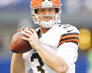Cleveland Browns quarterback Brandon Weeden throws before Saturday night’s game against the Indianapolis Colts at Lucas Oil Stadium in Indianapolis. The Colts beat the Browns, 27-6, but Weeden says he’s not worried.