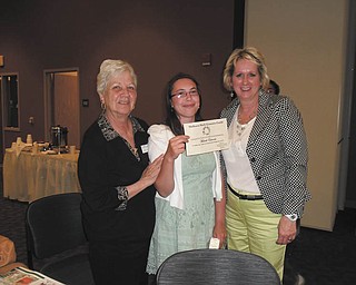 SPECIAL TO THE VINDICATOR
Each year the Holborn Herb Growers Guild awards a scholarship to a student who will be advancing his or her education in some form of horticulture. On the right, Yvonne Ford, president of Holborn Herb Growers Guild, presented a $1,000 check to Michelle Edwards, center. On the left is Terry Ham, scholarship chairwoman. Edwards is a second-year student at Ohio State University Agricultural Technology Institute. The guild’s purpose is to educate members and the public about the culture and uses of herbs. The guild maintains the summer kitchen gardens at Boardman Park and the gardens at the Western Reserve Village at Canfield Fairgrounds. To join, call Shirley Szabo, membership chairman, at 330-758-1836.