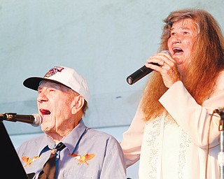 Jackie and Mary Ruth Robinson sing in the Robinson Family Band at the Canfield Fair, which began Wednesday. The Robinson family has been performing at the fair for 22 years.