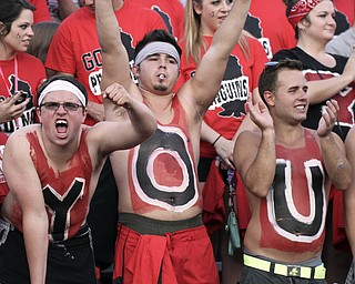 William d Lewis The Vindicator YSU students l-r Ansel Morsillo, Tyller(CORRECT) Schonce and Jason Heyman show their penguin spiriit during opener Thursday with dayton. They and other students spelled YOUNGSTOWN on thier chests.