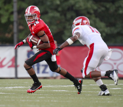 William D Lewis The Vindicator  YSU'sMarcel Caver(16) scampers for yardage past Dayton's Luke Welsh(15)during 1rst half action Thursday 8-28-13.