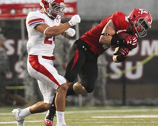 William D Lewis The Vindicator YSU's Christian Bryan(2) pulls in a pass past Dayton's Zach Elias(27)during 1rst half action against Dayton Thursday 8-28-13.
