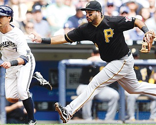 Pittsburgh Pirates third baseman Pedro Alvarez tags out the Milwaukee Brewers’ Norichika Aoki during the third inning of a game Monday in Milwaukee. Aoki tried to score from third on a hit by Jonathan Lucroy.