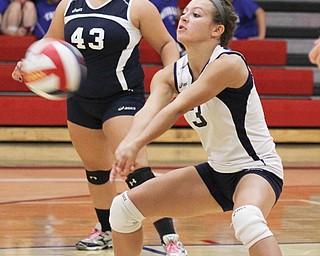 Austintown Fitch senior Cali Mikovich (3) digs the ball during a match against Hubbard at Fitch High School on
Tuesday. The Falcons won in five games.