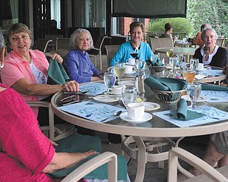 From left, Patty Ikonen, the featured guest, and book-club members Carol Ostheimer, Marianne Morano, Nancy Bare, Fran Lynn-Into, Rose Guerrieri and Katie Shipka met last month to review "Things Fall Apart" by Chinua Achebe.