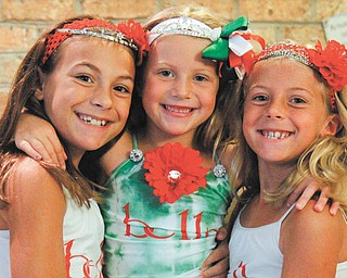 From left, sisters Brianna, 10, Juliana, 5, and Arianna DiFabio, 8, of Poland have won the Miss Italian Princess pageant at the Mount Carmel Fest — in 2009, 2010 and this year. Photo by: MADELYN P. HASTINGS | THE VINDICATOR.
