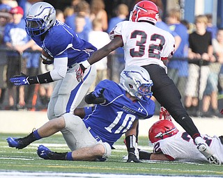 William d Lewis The Vindicator  Hubbard's LJ Scott(3) eludes Girard's Tryvon Mills(32) while Hubbards Tyler Taafe(10) is in foreground during first qtr action Friday atHubbard.