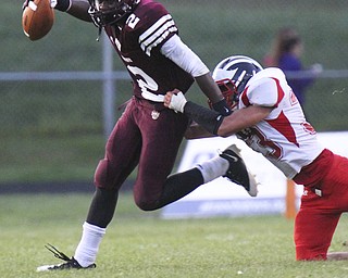 William DLewis The Vindicator  Liberty's Asim Pleas( 2) is tripped up by NilesAntonio solitto(33) during 2nd qtr action at Liberty 9-6-13.