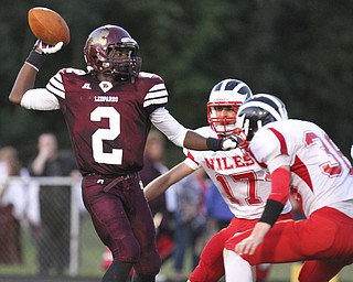 William DLewis The Vindicator  Liberty's Asim Pleas( 2) is pursued by by Niles' Richard Limongi(17) and Cody Zuschlag(38) during 2nd qtr action at Liberty 9-6-13.