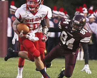 William D. Lewis The Vindicator  Niles' Chris Parry(10) eludes Liberty's Darryl McCullough (84)during 2nd qtr action at Liberty 9-6-13.