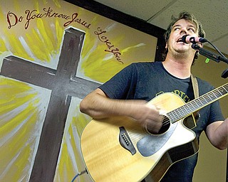 Matt Minnick of Newton Falls sings one of his original Christian songs during a recent Saturday praise and worship service at Second Chance Ministry. The ministry is moving from its current Austintown location to 3415 Canfield Road, Youngstown. Minnick will sing there Sept. 28.