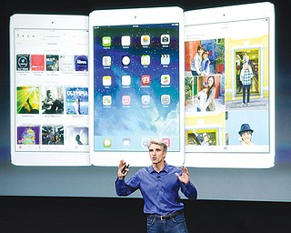 Craig Federighi, senior vice president of software engineering at Apple, speaks during the new-product release in Cupertino, Calif., on Tuesday.Apple’s latest iPhones will come in a bevy of colors and two distinct designs, one made of plastic and one that aims to be “the gold standard of smartphones” and reads your fingerprint.