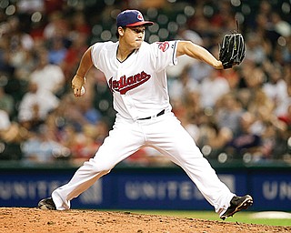 Cleveland Indians relief pitcher Chen-Chang Lee delivers a pitch in the eighth inning of a game against the Kansas City Royals in Cleveland on Tuesday.
