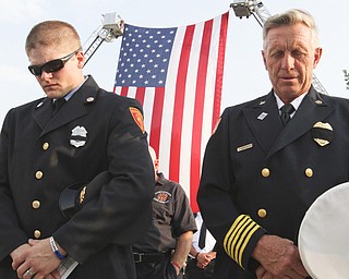 William D. Lewis The Vindicator Ellsworth twp firefighter Jeremy Hartman, left, and Ellsworth FD Chief Sherman Yeager during 9-11 ceremony in Austintown Wed.