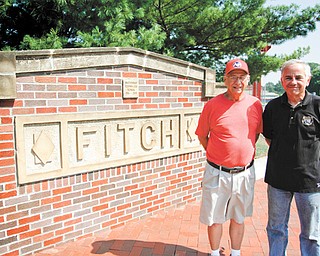 Jack Kidd, left, and Larry Cadman stand before the Austintown Veteran’s Memorial located at Falcon Stadium. The memorial began as project to honor their friends, Army 2nd. Lt. Charles Brown and Marine Sgt. James
Prommersberger, who were both killed in action in the Vietnam War.