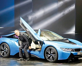 BMW CEO Norbert Reithofer gets out of the BMW i8 plug-in hybrid sports car during its world premiere at the
first press day of the 65th Frankfurt Auto Show in Frankfurt, Germany. More than 1,000 exhibitors will show
their products to the public from today through Sept. 22.