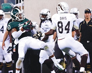 Michigan State’s Kurtis Drummond (27) intercepts a pass in a game against Western Michigan in East Lansing, Mich. Drummond, a former Hubbard High football standout who made his college debut two years ago against YSU, has emerged as one of the best players on one of the best defenses in the country. The Spartans and Penguins meet Saturday at MSU.