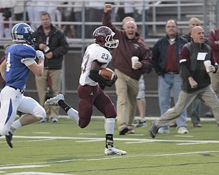 ROBERT  K. YOSAY | THE VINDICATOR..Boardmans #23 Dawan Britt breaks for the Endzone as the sidelines cheered Polnas #4 Dylan Garver in pursuit . .He was stopped yards before the TD.Boardman Spartans at Poland Bulldogs Stadium