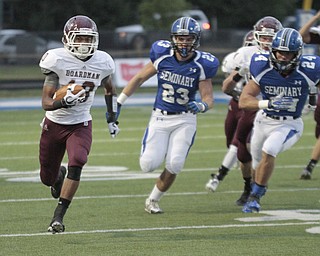  .          ROBERT  K. YOSAY | THE VINDICATOR.Early in the First quarter action as BDM as #10 Turel Thompson ) rambles for a first down as #23 Adam Wollet and #24 Austin Wilson for Poland in pursuit ..Boardman Spartans at Poland Bulldogs Stadium