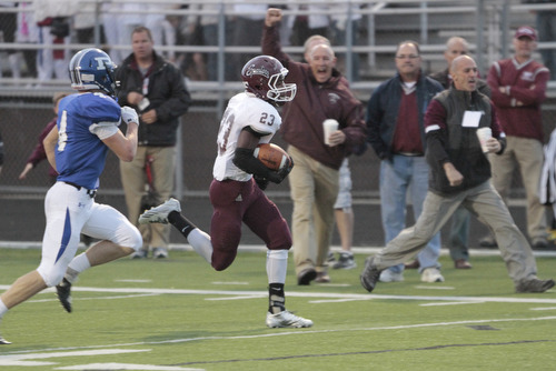  .          ROBERT  K. YOSAY | THE VINDICATOR..Boardmans #23 Dawan Britt breaks for the Endzone as the sidelines cheered Polnas #4 Dylan Garver in pursuit . .He was stopped yards before the TD.Boardman Spartans at Poland Bulldogs Stadium