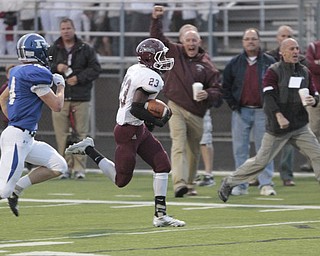  .          ROBERT  K. YOSAY | THE VINDICATOR..Boardmans #23 Dawan Britt breaks for the Endzone as the sidelines cheered Polnas #4 Dylan Garver in pursuit . .He was stopped yards before the TD.Boardman Spartans at Poland Bulldogs Stadium