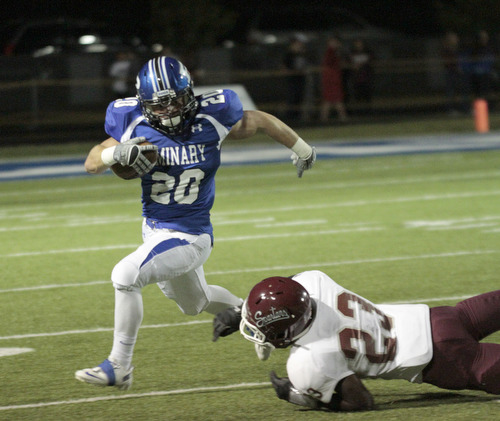  .          ROBERT  K. YOSAY | THE VINDICATOR..Polands #20 Ross Gould Breaks around BDM #23 Dawan Britt as he goes for 20+ yards during third quarter action before being run out of bounds.Boardman Spartans at Poland Bulldogs Stadium