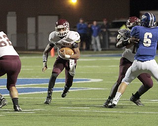  .          ROBERT  K. YOSAY | THE VINDICATOR..BDM #3 Darius Sanders breaks out of the backfield as Polands #6 Geno Petrus is blocked  and Bdm #63 Devon Washington opens the whole for a first down.Boardman Spartans at Poland Bulldogs Stadium