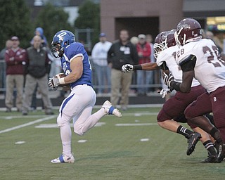  .          ROBERT  K. YOSAY | THE VINDICATOR..Polands #20 Ross Gould  runs for 94 YARD TD  run as BdM #28 Ian Adu_Poku and #14 Matt Filipovich  give chase .Boardman Spartans at Poland Bulldogs Stadium