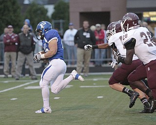 ROBERT  K. YOSAY | THE VINDICATOR..Polands #20 Ross Gould  runs for 94 YARD TD  run as BdM #28 Ian Adu_Poku and #14 Matt Filipovich  give chase .Boardman Spartans at Poland Bulldogs Stadium