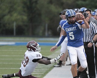  .          ROBERT  K. YOSAY | THE VINDICATOR..Polands QB #5 Jacob Wolfe is pushed out of bounds after a short gain by Boardmans #28   Ivan Adu-Poku during first half action..Boardman Spartans at Poland Bulldogs Stadium